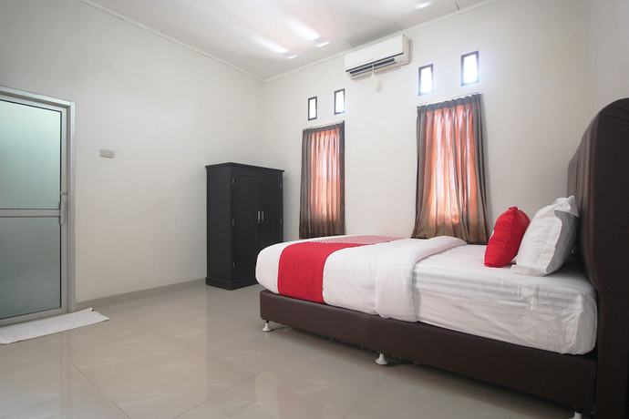 Imagen de la habitación del Hotel OYO 1547 Wisma Ray Syariah. Foto 2