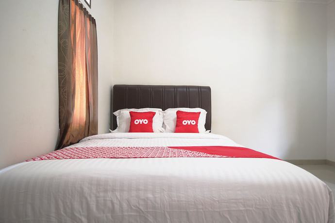 Imagen de la habitación del Hotel OYO 1547 Wisma Ray Syariah. Foto 11