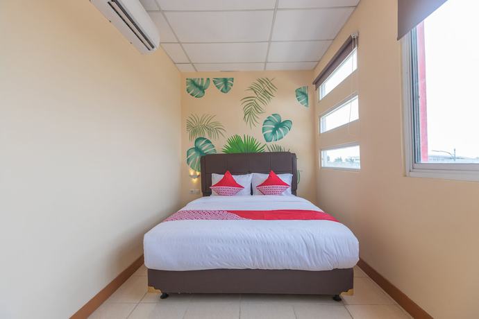 Imagen de la habitación del Hotel OYO 1552 Iodium Residence. Foto 12