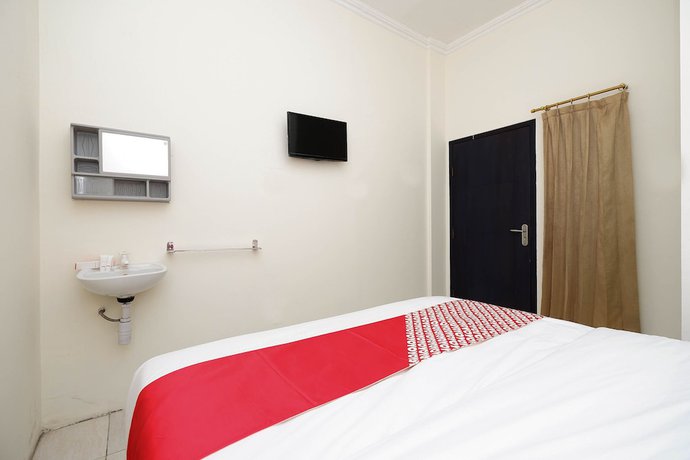 Imagen de la habitación del Hotel OYO 1620 Sion Family Residence. Foto 7