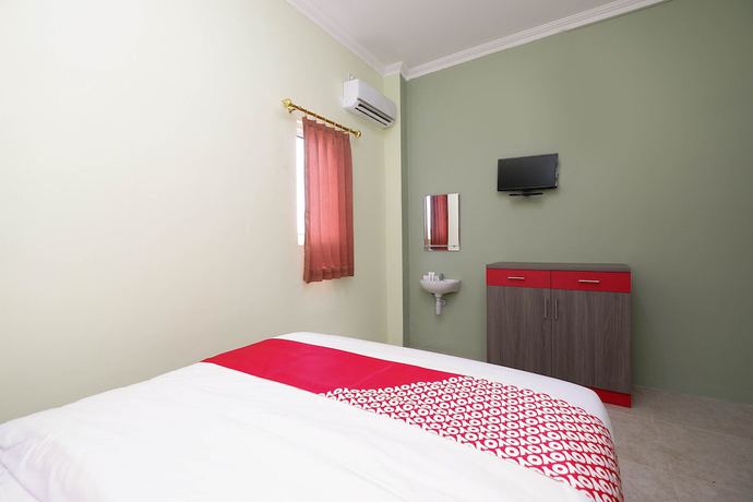Imagen de la habitación del Hotel OYO 1620 Sion Family Residence. Foto 8