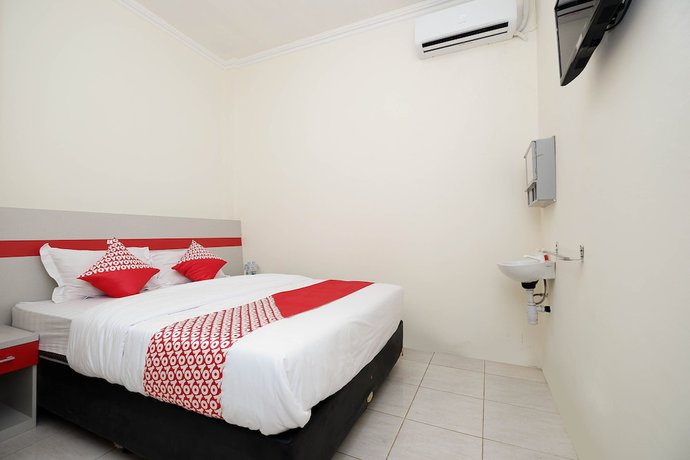 Imagen de la habitación del Hotel OYO 1620 Sion Family Residence. Foto 9