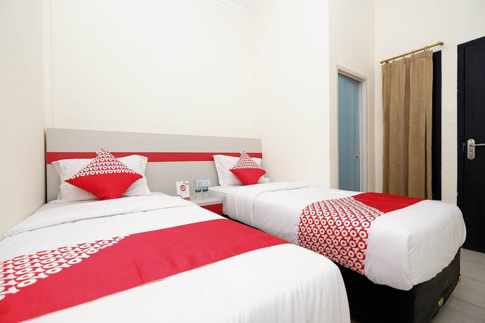 Imagen de la habitación del Hotel OYO 1620 Sion Family Residence. Foto 10