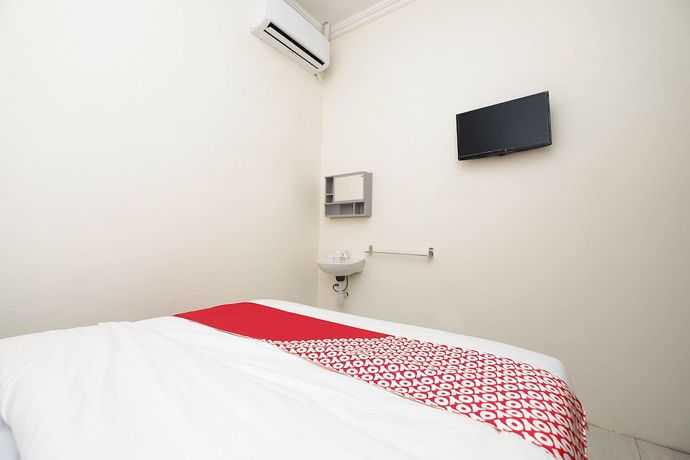 Imagen de la habitación del Hotel OYO 1620 Sion Family Residence. Foto 11