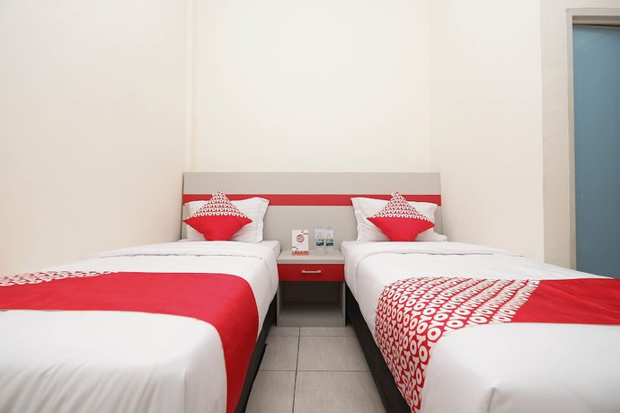 Imagen de la habitación del Hotel OYO 1620 Sion Family Residence. Foto 13