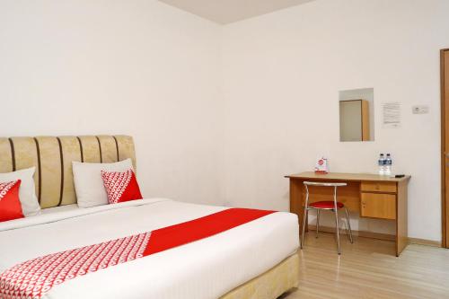 Imagen de la habitación del Hotel OYO 1673 M Authentic Kost Man. Foto 18