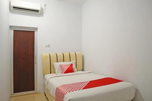 Imagen de la habitación del Hotel OYO 1673 M Authentic Kost Man. Foto 20