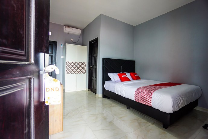 Imagen de la habitación del Hotel OYO 1680 Hanna Residence. Foto 7