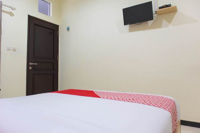 Imagen de la habitación del Hotel OYO 1681 The Kost Tdm 2. Foto 9