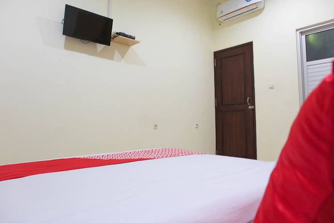 Imagen de la habitación del Hotel OYO 1681 The Kost Tdm 2. Foto 15