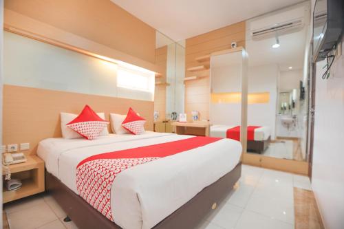 Imagen de la habitación del Hotel OYO 180 Mirah. Foto 6