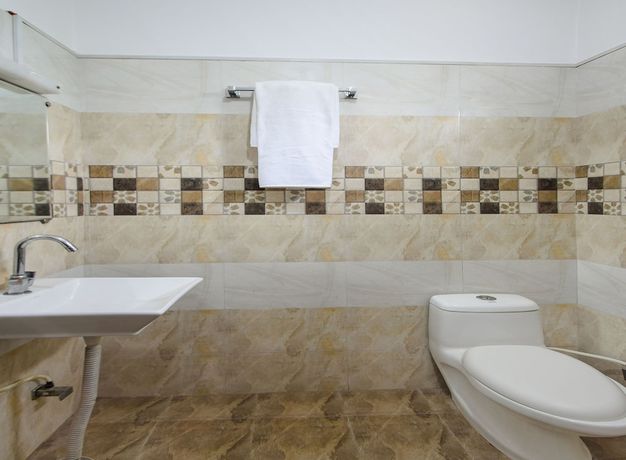Imagen de la habitación del Hotel OYO 18262 White Tulip. Foto 10