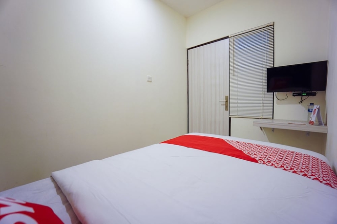 Imagen de la habitación del Hotel OYO 1838 COZY Home. Foto 8