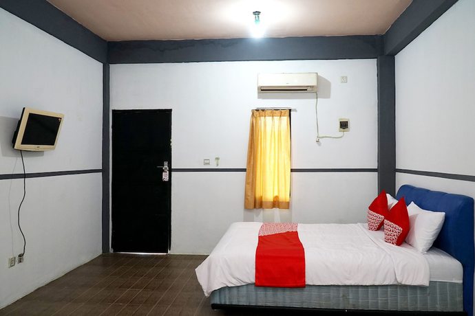 Imagen de la habitación del Hotel OYO 1861 Martha Guest House. Foto 3
