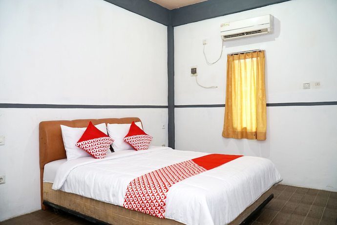 Imagen de la habitación del Hotel OYO 1861 Martha Guest House. Foto 4