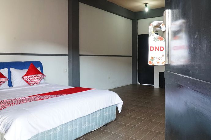 Imagen de la habitación del Hotel OYO 1861 Martha Guest House. Foto 9
