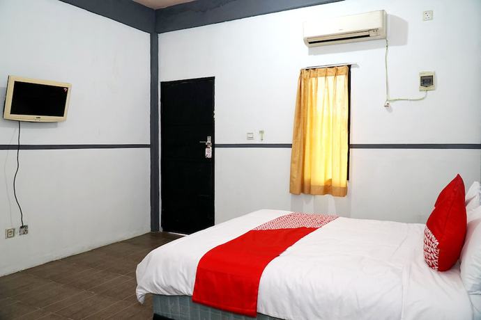 Imagen de la habitación del Hotel OYO 1861 Martha Guest House. Foto 10