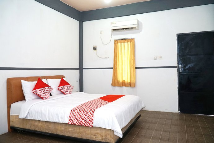 Imagen de la habitación del Hotel OYO 1861 Martha Guest House. Foto 11