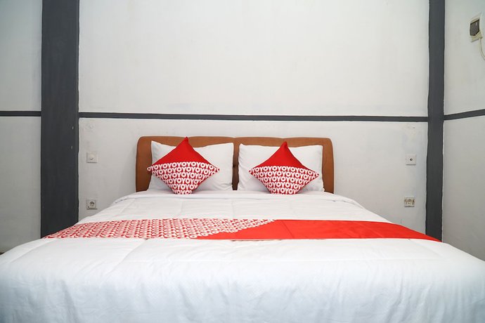 Imagen de la habitación del Hotel OYO 1861 Martha Guest House. Foto 12