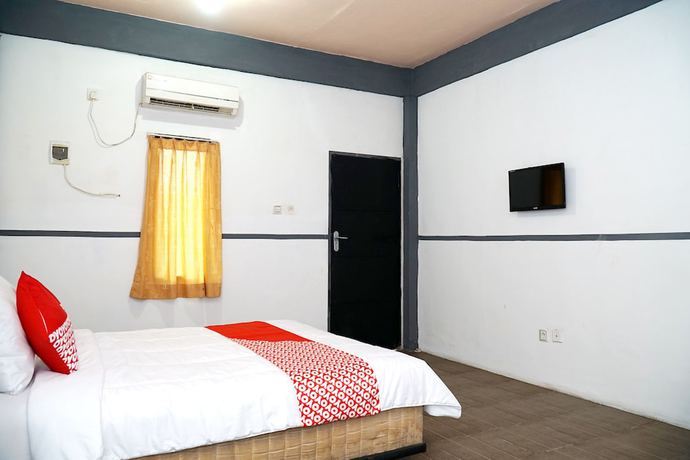 Imagen de la habitación del Hotel OYO 1861 Martha Guest House. Foto 17