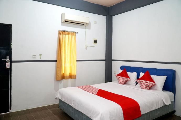 Imagen de la habitación del Hotel OYO 1861 Martha Guest House. Foto 18