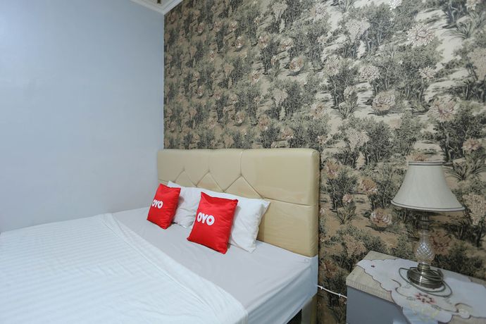 Imagen de la habitación del Hotel OYO 1864 Tiara Guest House. Foto 2