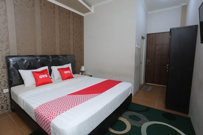 Imagen de la habitación del Hotel OYO 1864 Tiara Guest House. Foto 3