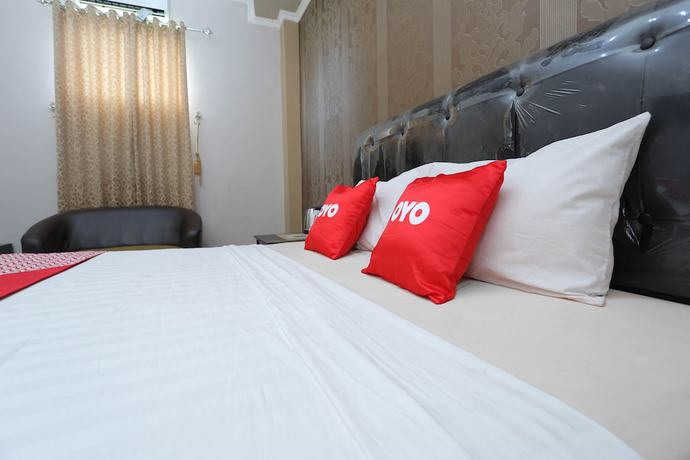 Imagen de la habitación del Hotel OYO 1864 Tiara Guest House. Foto 7