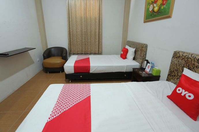 Imagen de la habitación del Hotel OYO 1864 Tiara Guest House. Foto 9