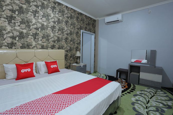 Imagen de la habitación del Hotel OYO 1864 Tiara Guest House. Foto 10