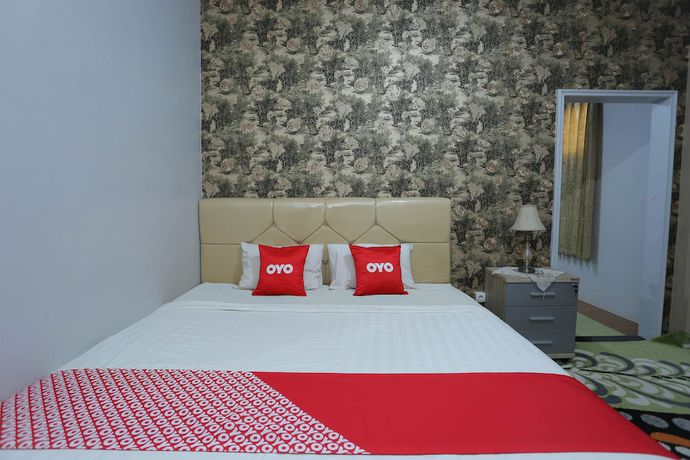 Imagen de la habitación del Hotel OYO 1864 Tiara Guest House. Foto 11