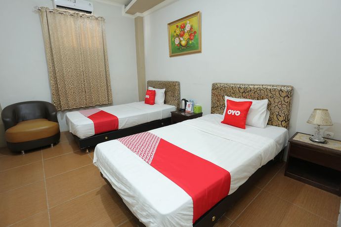 Imagen de la habitación del Hotel OYO 1864 Tiara Guest House. Foto 13