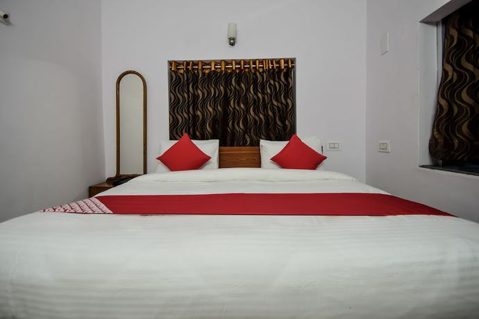 Imagen de la habitación del Hotel OYO 18671 Ashirwad Palace. Foto 14