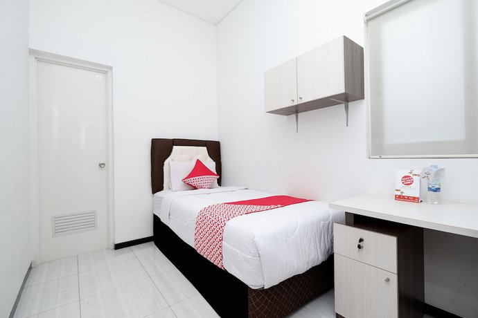 Imagen de la habitación del Hotel OYO 1884 Sunshine Hostel. Foto 4