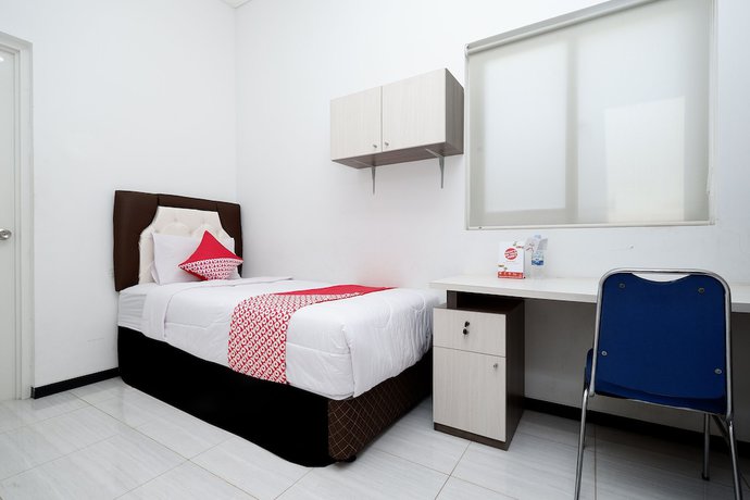 Imagen de la habitación del Hotel OYO 1884 Sunshine Hostel. Foto 6