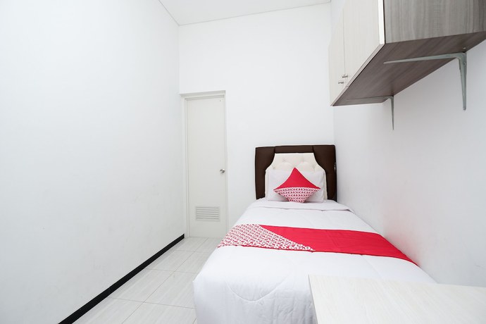 Imagen de la habitación del Hotel OYO 1884 Sunshine Hostel. Foto 8