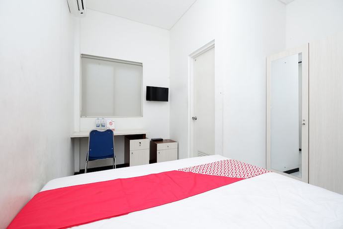 Imagen de la habitación del Hotel OYO 1884 Sunshine Hostel. Foto 13