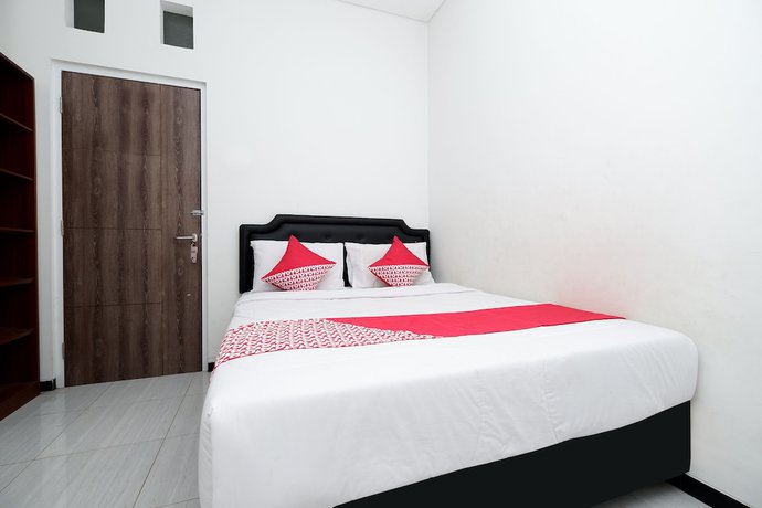 Imagen de la habitación del Hotel OYO 1884 Sunshine Hostel. Foto 14