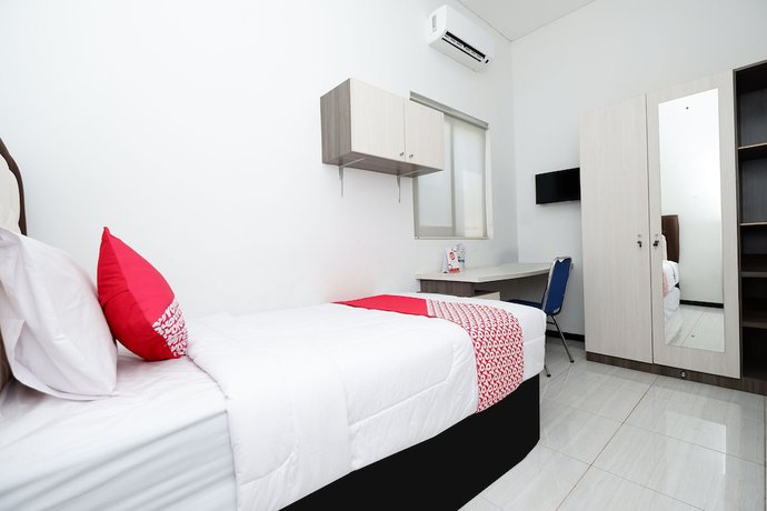 Imagen de la habitación del Hotel OYO 1884 Sunshine Hostel. Foto 15