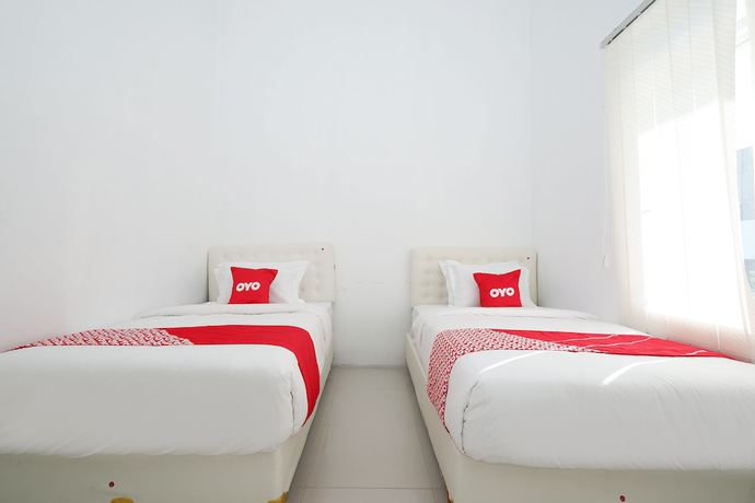 Imagen de la habitación del Hotel OYO 1888 Griya RW Family Guest House. Foto 2