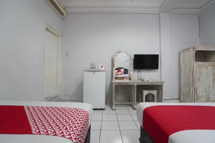 Imagen de la habitación del Hotel OYO 1934 Sedana Inn. Foto 8
