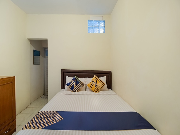 Imagen de la habitación del Hotel OYO 1982 Golf Papa Costel. Foto 2