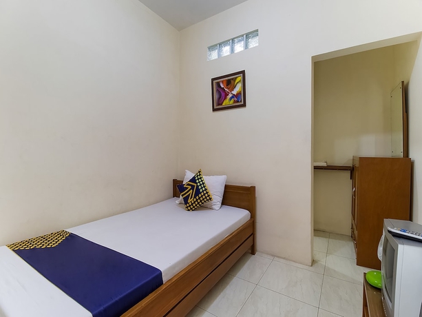 Imagen de la habitación del Hotel OYO 1982 Golf Papa Costel. Foto 3