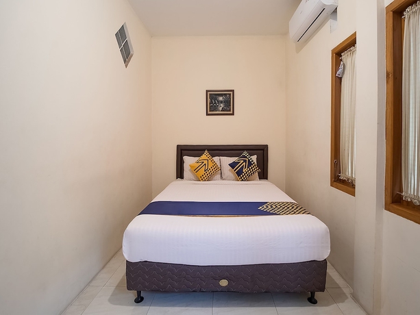 Imagen de la habitación del Hotel OYO 1982 Golf Papa Costel. Foto 5