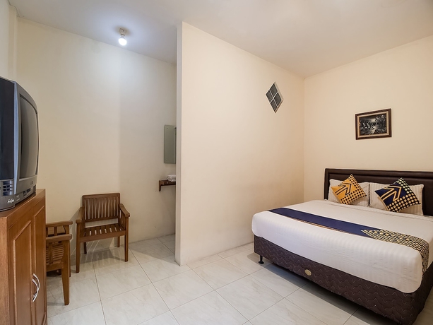 Imagen de la habitación del Hotel OYO 1982 Golf Papa Costel. Foto 6