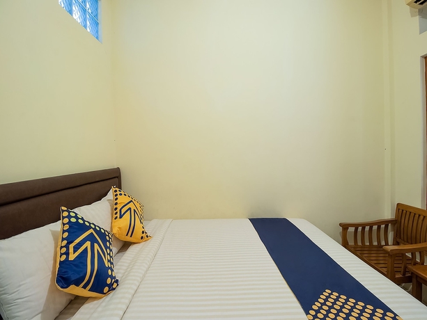 Imagen de la habitación del Hotel OYO 1982 Golf Papa Costel. Foto 7