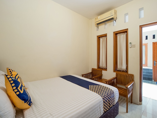 Imagen de la habitación del Hotel OYO 1982 Golf Papa Costel. Foto 8