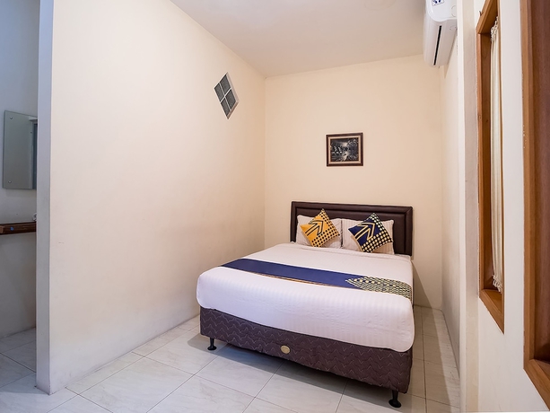 Imagen de la habitación del Hotel OYO 1982 Golf Papa Costel. Foto 9