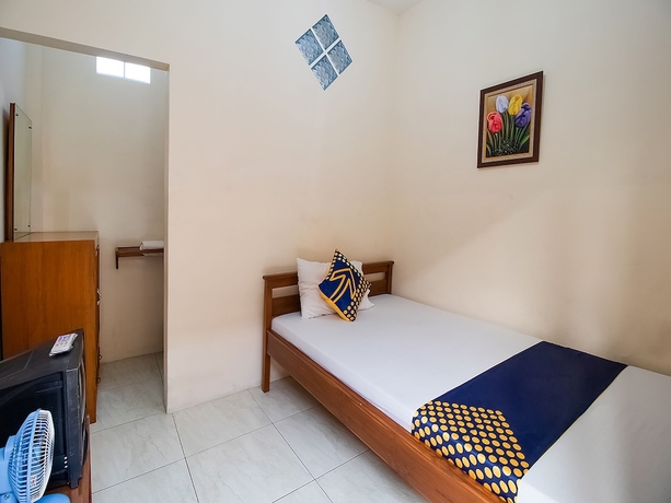 Imagen de la habitación del Hotel OYO 1982 Golf Papa Costel. Foto 11