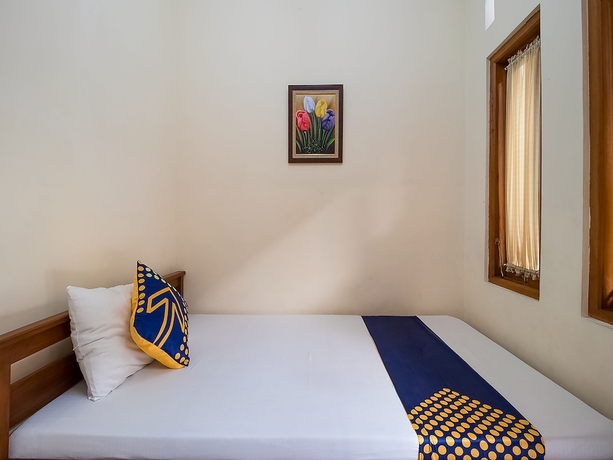 Imagen de la habitación del Hotel OYO 1982 Golf Papa Costel. Foto 12